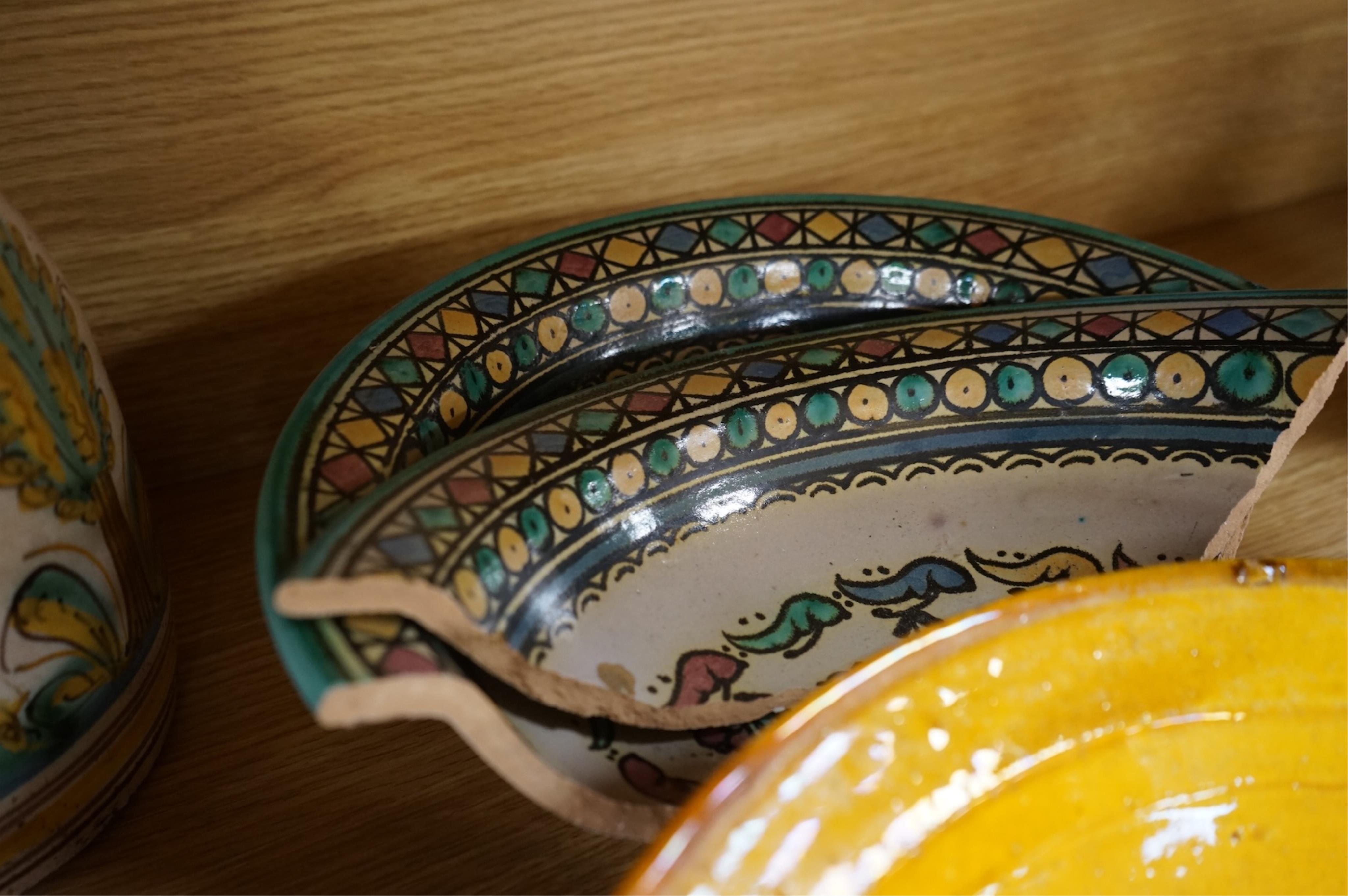 A late 17th century Spanish tin glazed jug together with Moroccan and pottery bowls and dishes (5). Jug 26cm high.